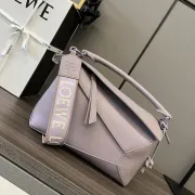 Loewe Puzzle Bag In Soft Lavender Leather With Branded Strap And Geometric Design #A50220 Loewe Puzzle Bag In Soft Lavender Leather With Branded Strap And Geometric Design #A50220